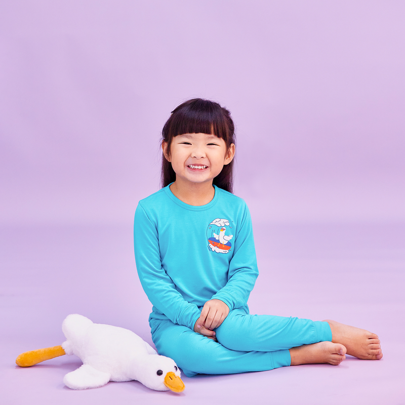 Girl Wearing OETEO Duckie's Day Off Bamboo Toddler Jammies (Teal)