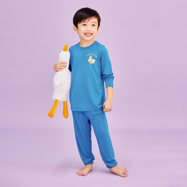 Boy Wearing OETEO Duckie's Day Off Bamboo Toddler Jammies (Blue)